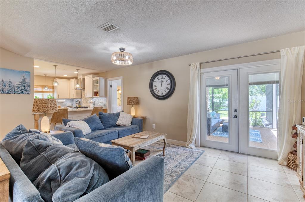 23 Fallon Lane Palm Coast, FL 32137 - Photo 43 of 77 a living room with furniture a clock and a clock