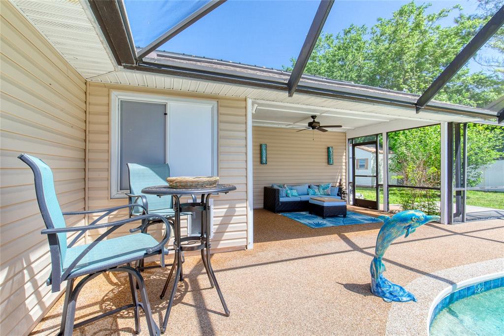 23 Fallon Lane Palm Coast, FL 32137 - Photo 49 of 77 a view of a patio with a table and chairs in patio