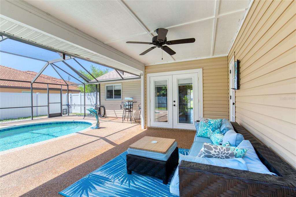 23 Fallon Lane Palm Coast, FL 32137 - Photo 53 of 77 a living room with furniture and a floor to ceiling window