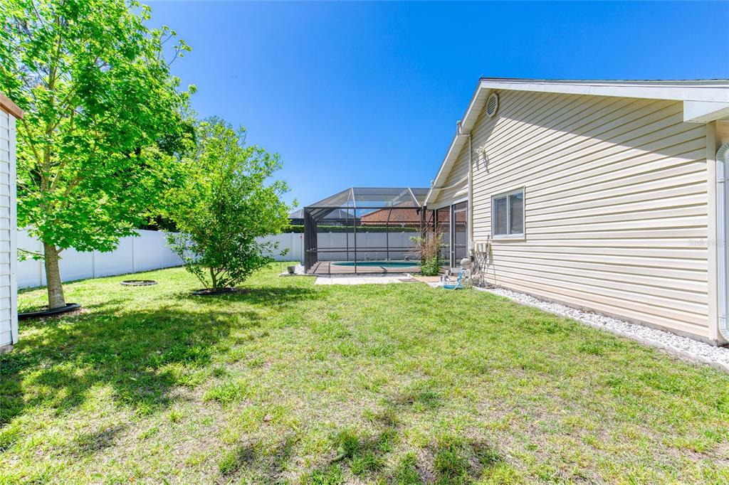 23 Fallon Lane Palm Coast, FL 32137 - Photo 55 of 77 a view of a house with a backyard
