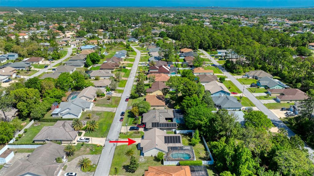 23 Fallon Lane Palm Coast, FL 32137 - Photo 77 of 77 an aerial view of residential houses with outdoor space and trees