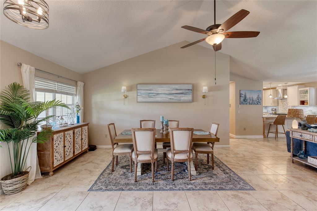 23 Fallon Lane Palm Coast, FL 32137 - Photo 8 of 77 a view of a dining room with furniture window and wooden floor