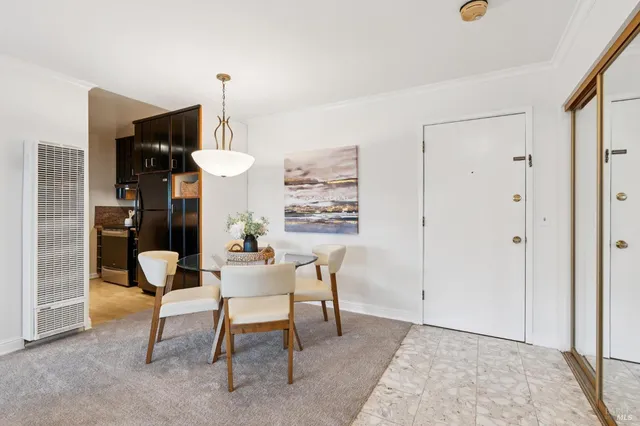 a living room with furniture and a lamp
