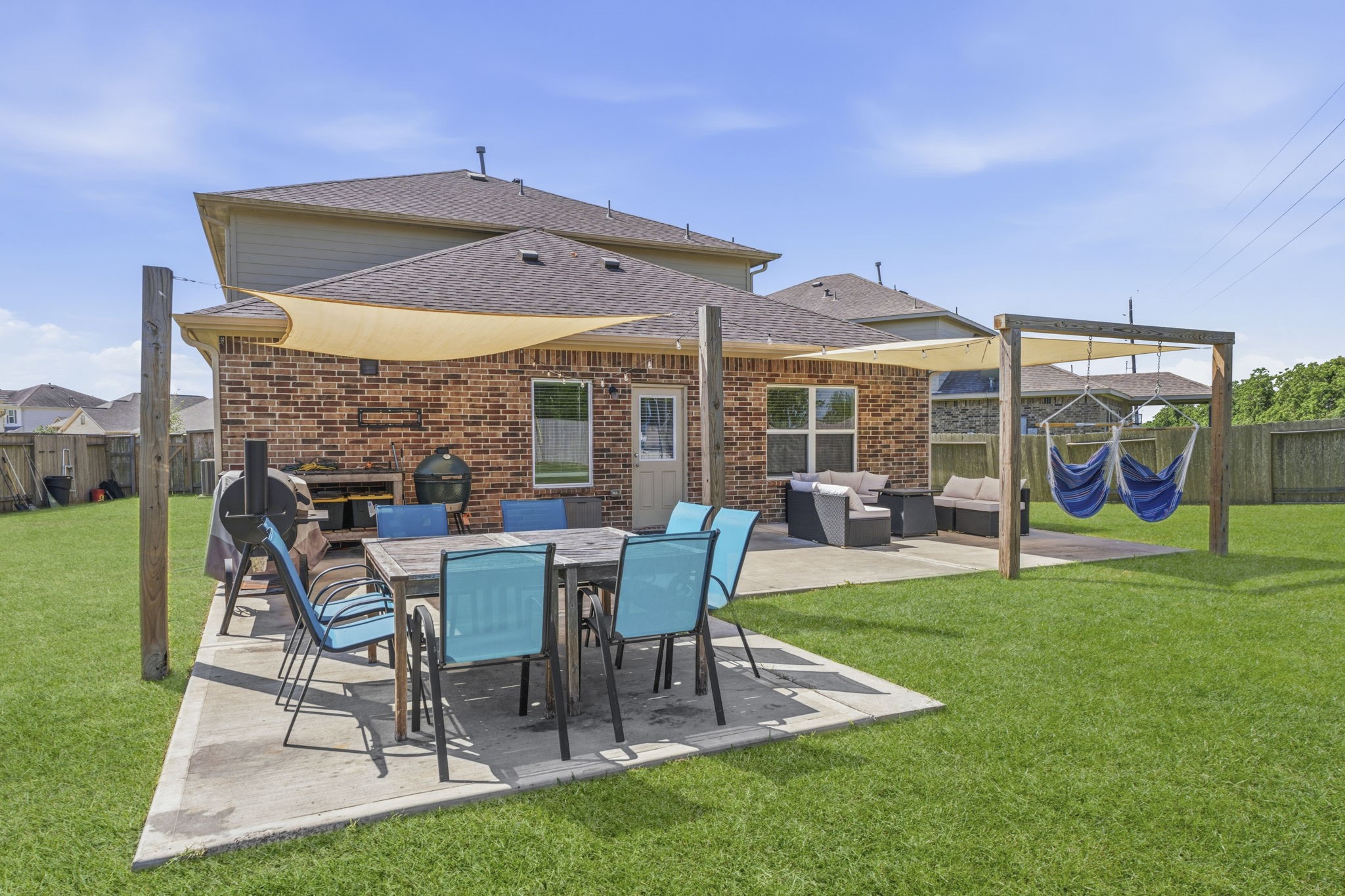 2401 Abbot Brk Drive Rosharon, TX 77583 - Photo 39 of 50 Three distinct outdoor entertaining areas offer exceptional versatility for relaxing, dining, and gathering, creating the perfect setting for both everyday enjoyment and memorable occasions.