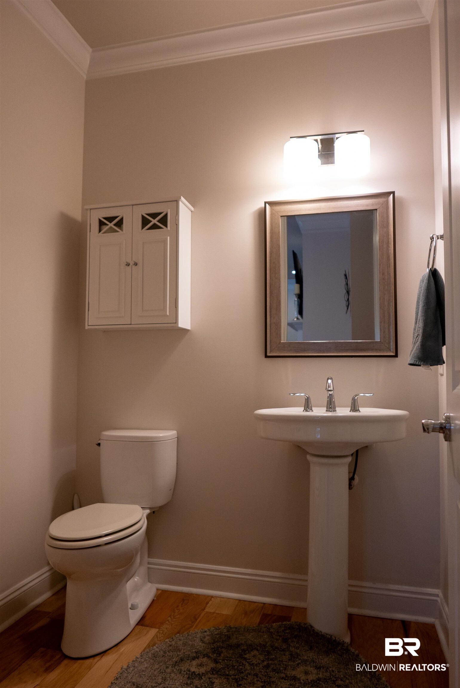 6684 Garrison Drive Daphne, AL 36527 - Photo 27 of 35 Bathroom featuring toilet, crown molding, and wood-type flooring