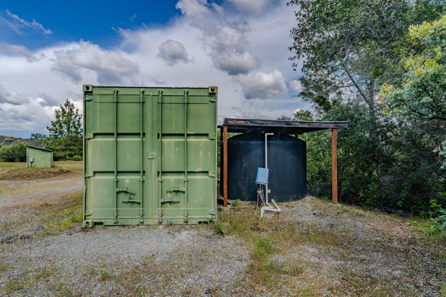 3155 Hawver Road San Andreas, CA 95249 - Photo 61 of 63 The Storage container, giving an area for extra storage. To the left in the photo is the well with the 2600 gallon water tank.