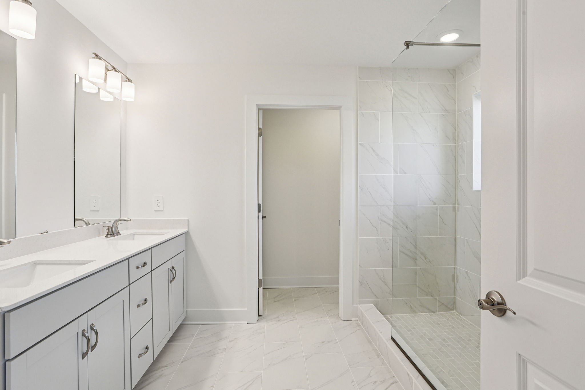2116 Riley Pk Drive Franklin, TN 37064 - Photo 30 of 47 a spacious bathroom with a granite countertop sink a mirror and a shower