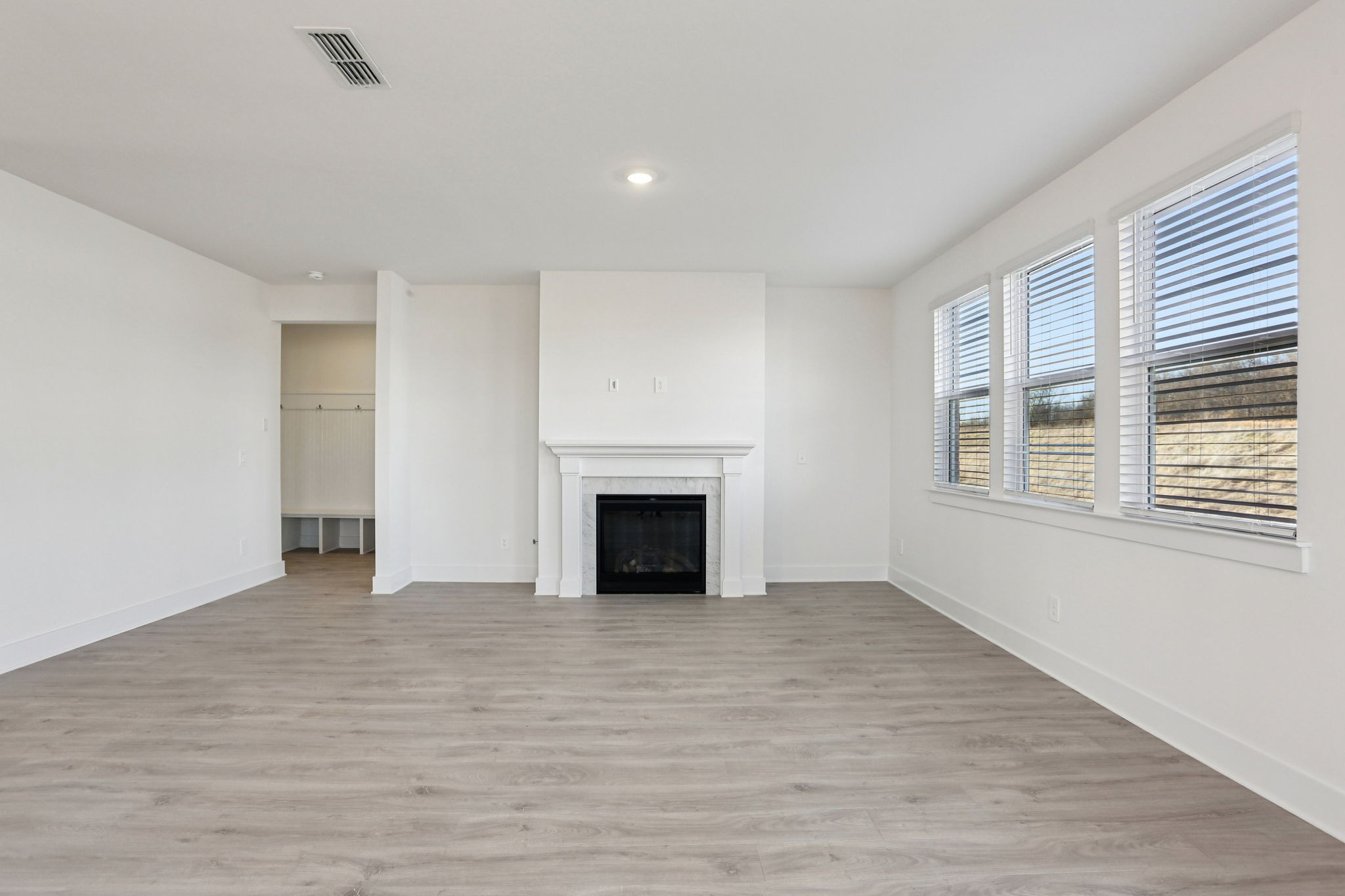 2116 Riley Pk Drive Franklin, TN 37064 - Photo 6 of 47 a view of empty room with wooden floor and fireplace