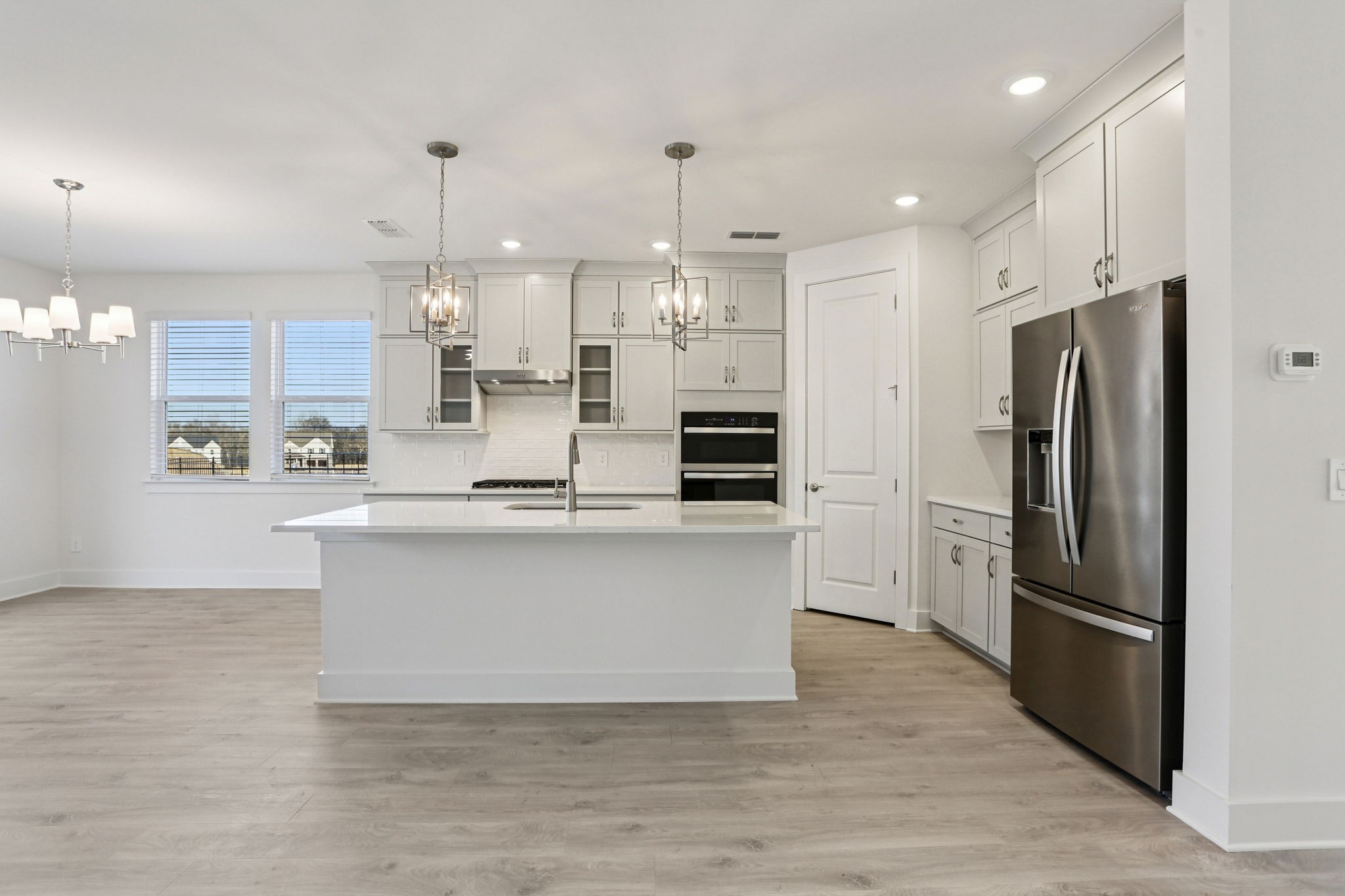 2116 Riley Pk Drive Franklin, TN 37064 - Photo 9 of 47 a kitchen with stainless steel appliances granite countertop a refrigerator a sink a stove and a wooden floors
