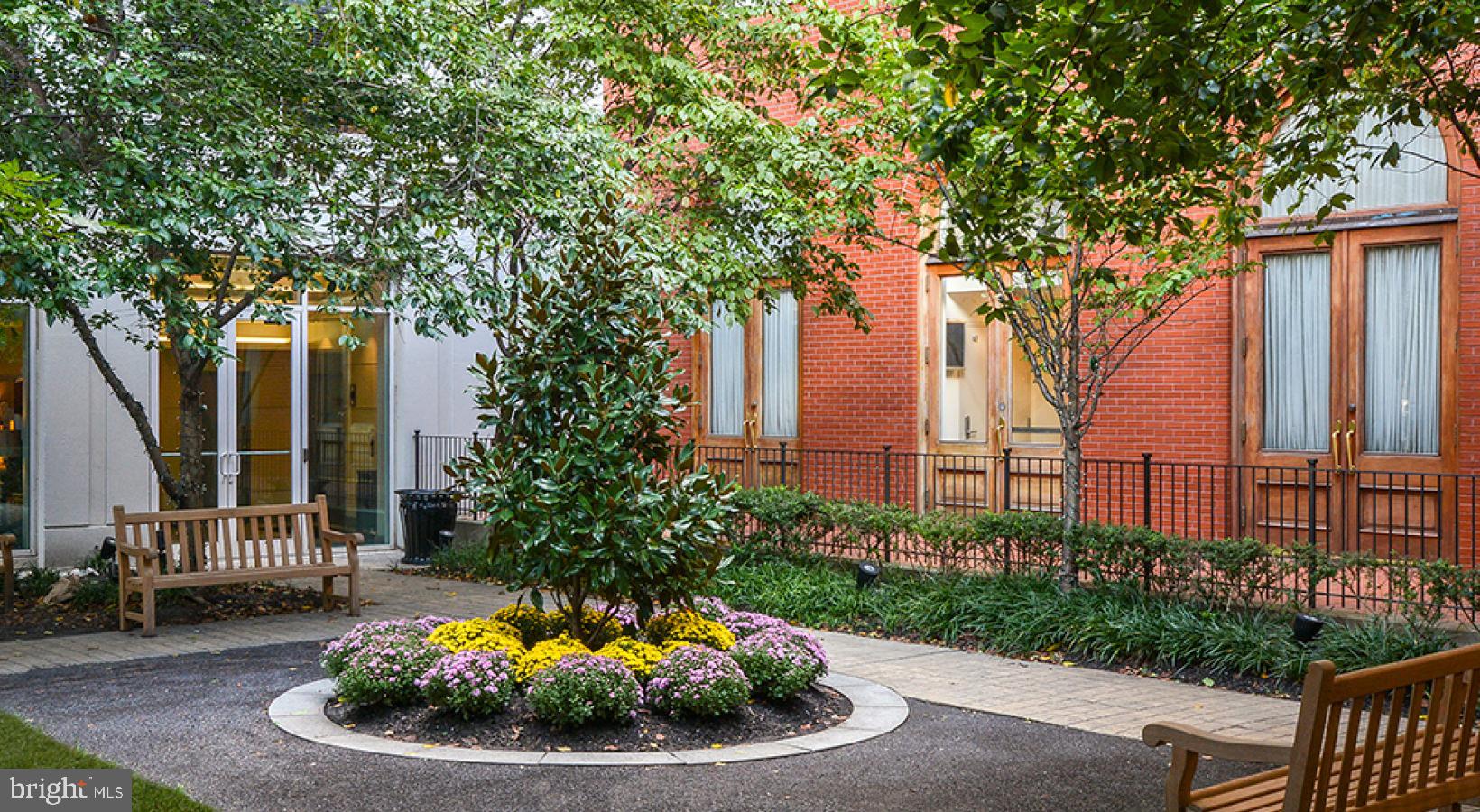 206 West Washington Square, Unit 1908 Philadelphia, PA 19106 - Photo 13 of 19 a view of a chair and table in backyard