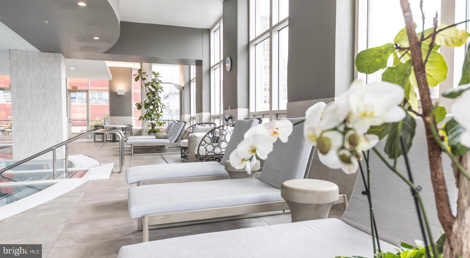 206 West Washington Square, Unit 1908 Philadelphia, PA 19106 - Photo 9 of 19 a living room with furniture and a large window