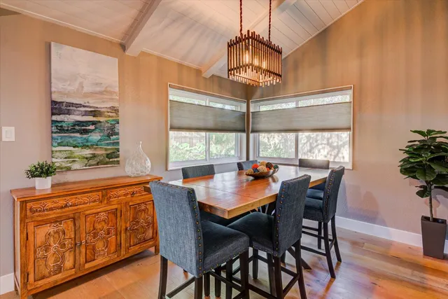 a kitchen with a sink a stove and cabinets