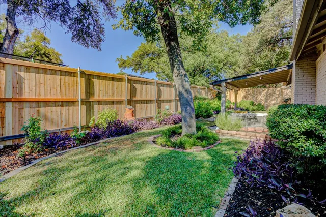 a backyard of a house with lots of green space