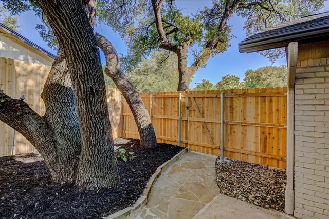 a backyard of a house with lots of green space