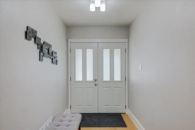 a view of a bedroom with a furniture and staircase