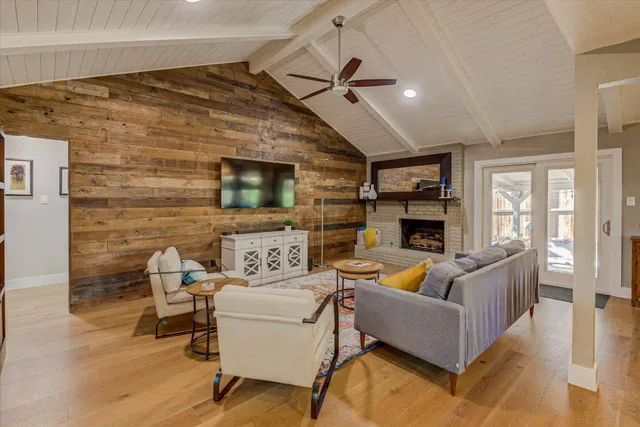 a living room with fireplace furniture and a fireplace