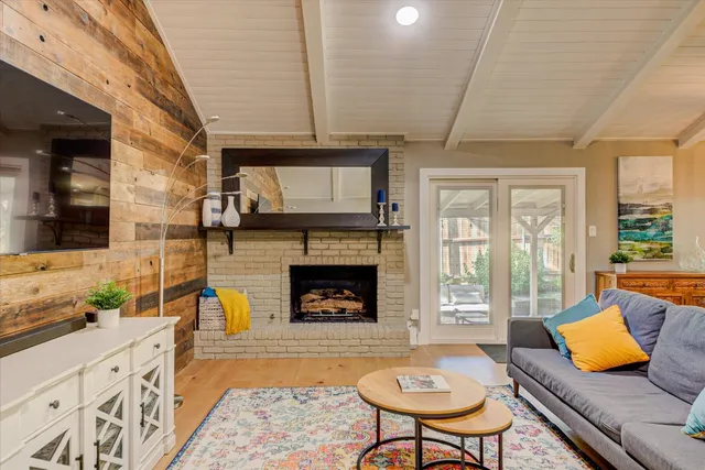 a living room with furniture and fireplace