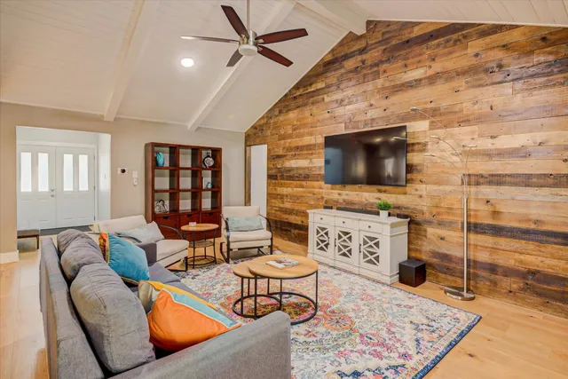 a living room with furniture and a rug