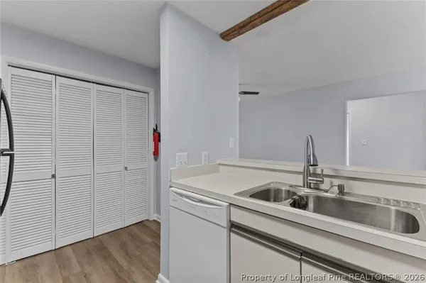 a kitchen that has a sink and a stove