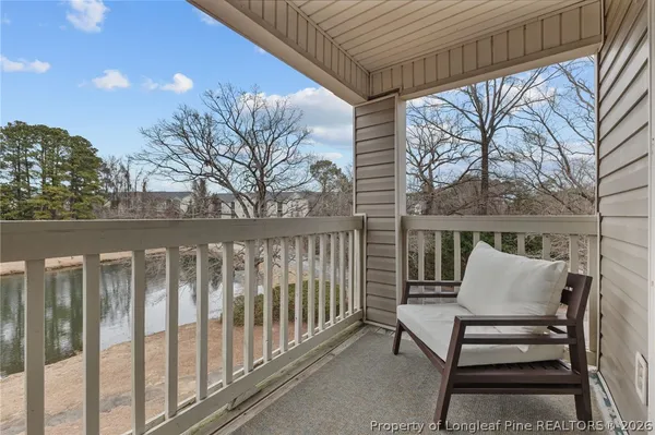 a view of wooden bench in the roof deck