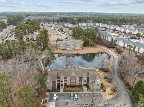 an aerial view of a residential houses with outdoor space