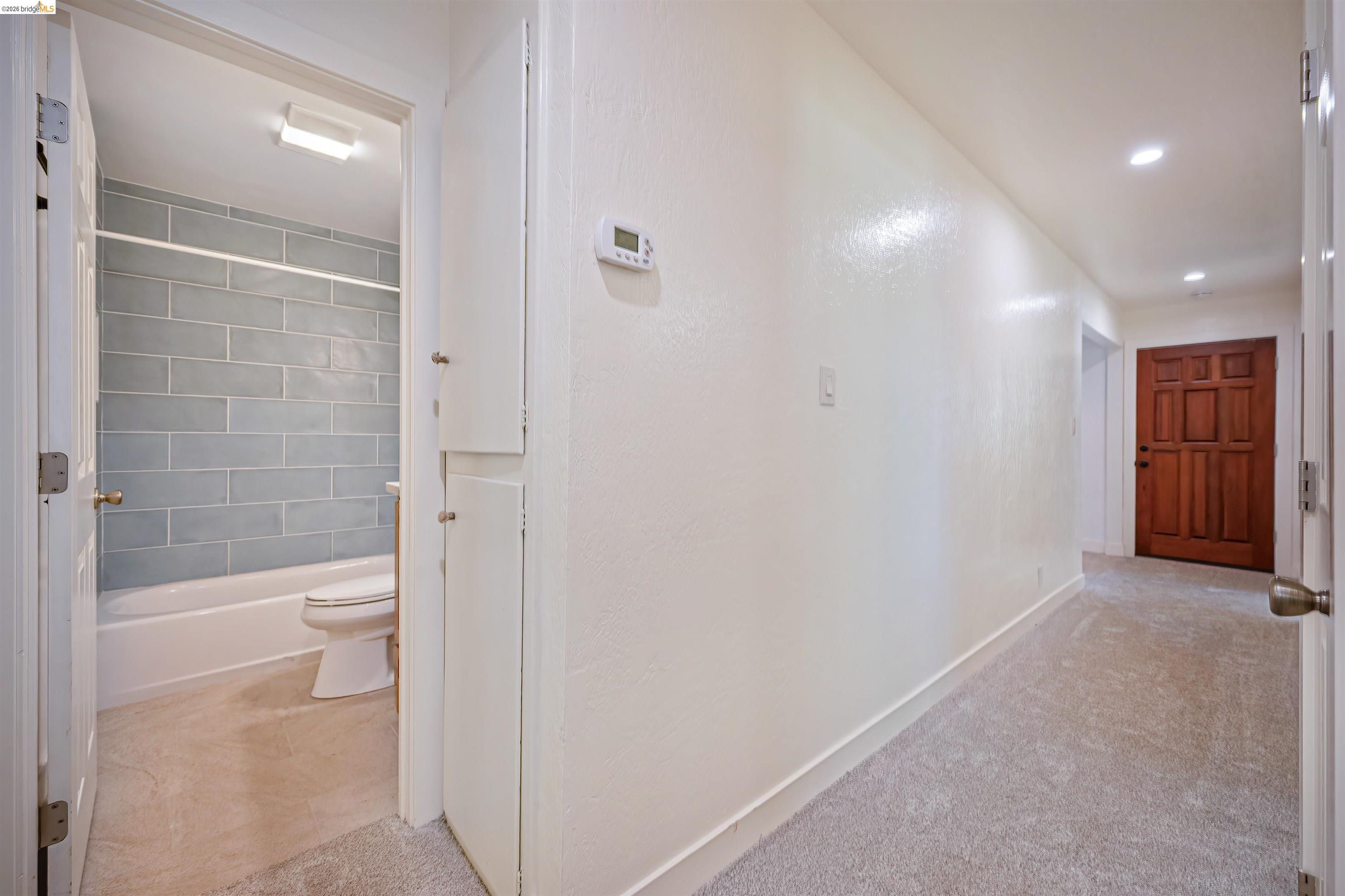 10474 Sheldon Road Elk Grove, CA 95624 - Photo 42 of 83 Hallway with light gray carpet and white walls