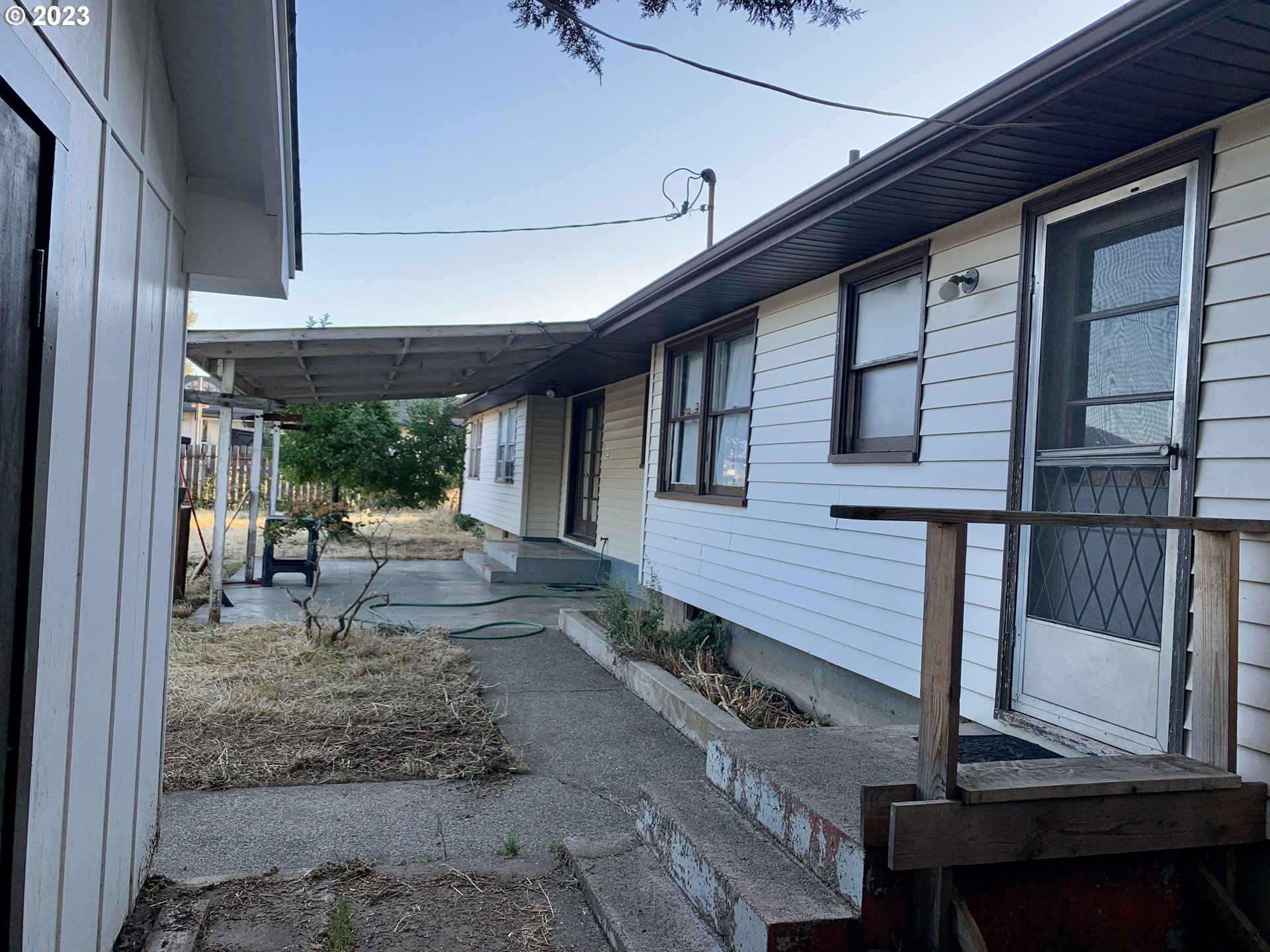 689 East 3rd Avenue Riddle, OR 97469 - Photo 8 of 17 a view of a patio with table and chairs and wooden floor
