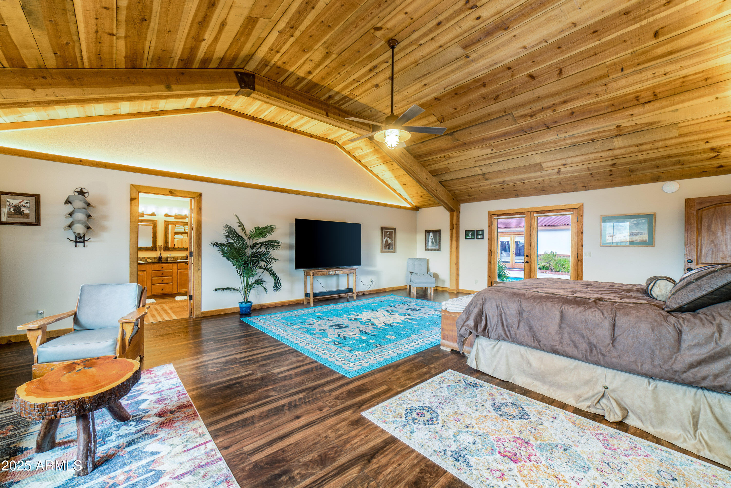 68 Curly Horse Ranch Road Sonoita, AZ 85637 - Photo 16 of 39 a living room with furniture and a flat screen tv