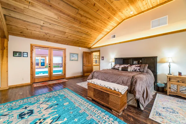 a spacious bathroom with a granite countertop sink and a mirror