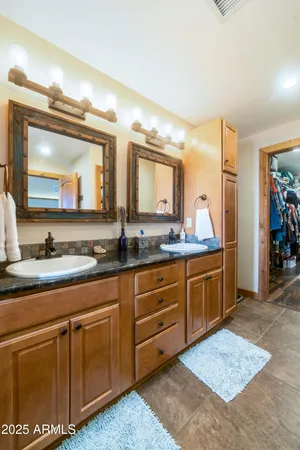 a large bathroom with a tub and shower