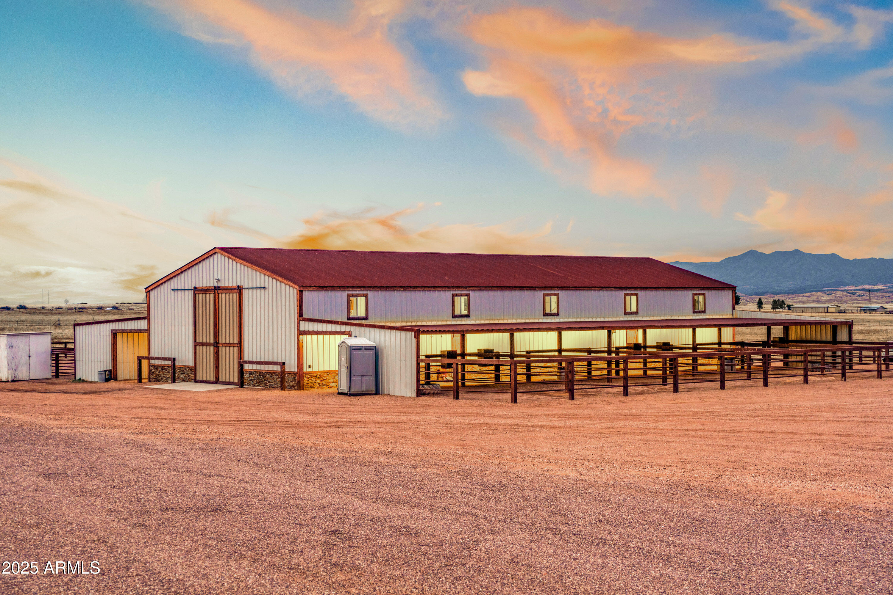 68 Curly Horse Ranch Road Sonoita, AZ 85637 - Photo 2 of 39 a view of a large white building