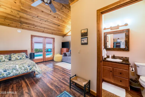 a swimming pool with outdoor seating and yard