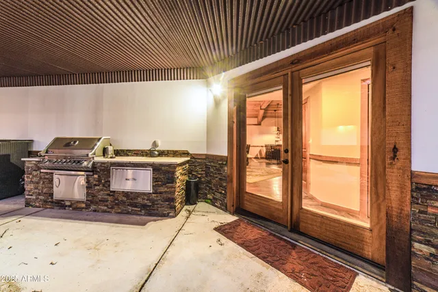 a view of an empty room with a floor to ceiling window