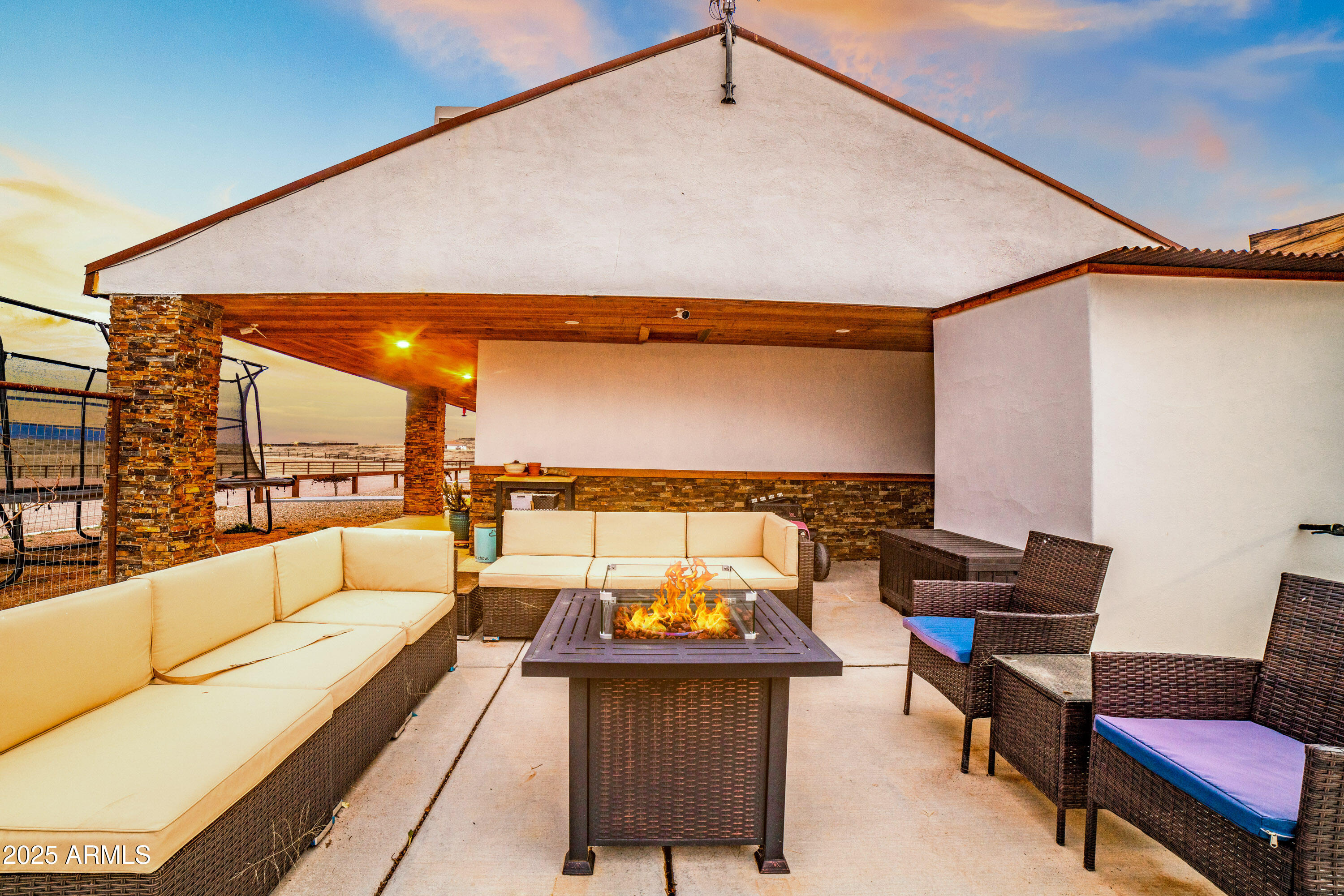 68 Curly Horse Ranch Road Sonoita, AZ 85637 - Photo 32 of 39 a balcony with furniture and a rug