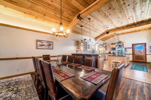 a view of a patio with table and chairs with wooden floor