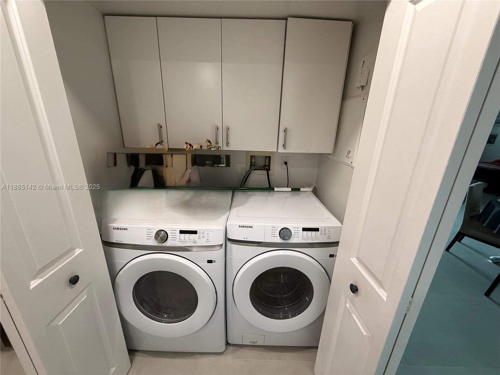 1250 South Miami Avenue, Unit 1603 Miami, FL 33130 - Photo 18 of 44 a utility room with dryer and washer