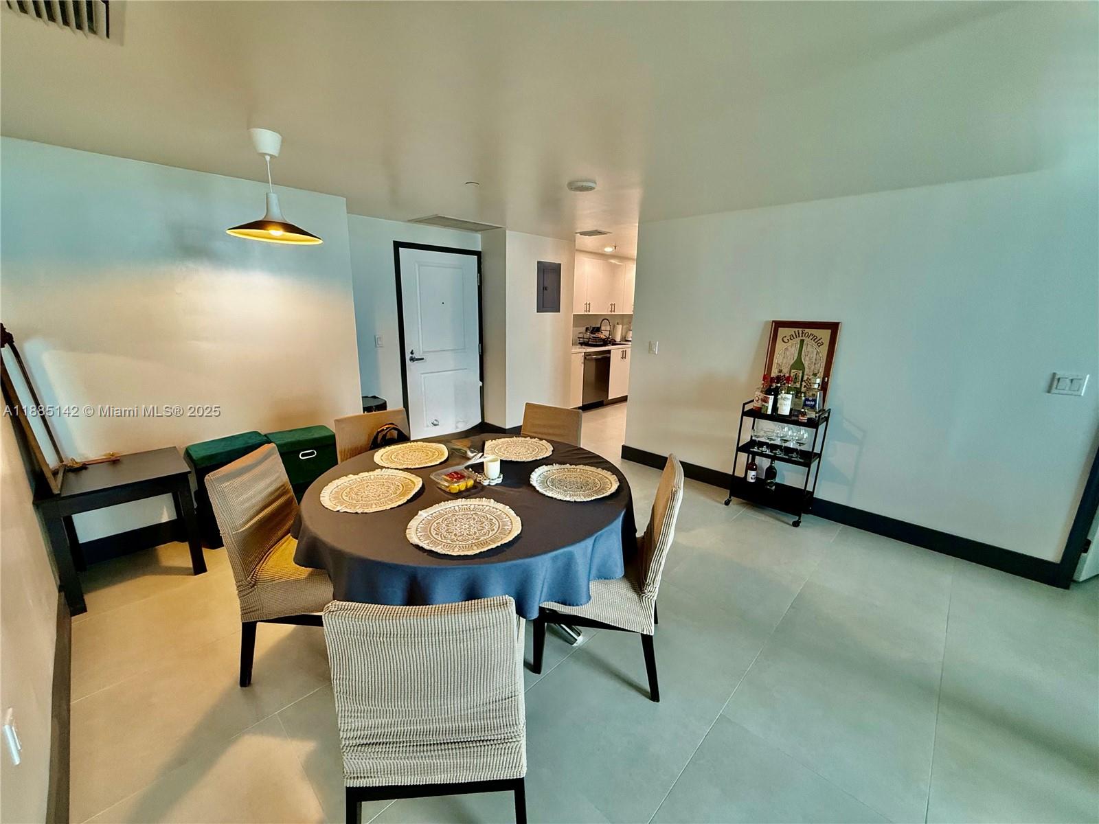 1250 South Miami Avenue, Unit 1603 Miami, FL 33130 - Photo 21 of 44 a view of a dining room with furniture and wooden floor