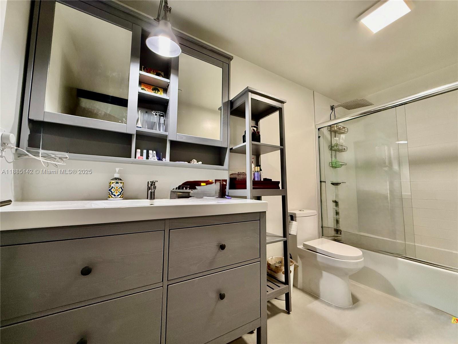 1250 South Miami Avenue, Unit 1603 Miami, FL 33130 - Photo 29 of 44 a bathroom with a sink a toilet and shower