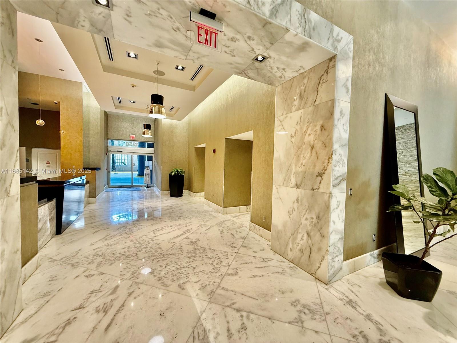 1250 South Miami Avenue, Unit 1603 Miami, FL 33130 - Photo 3 of 44 a view of a hallway and a livingroom with furniture