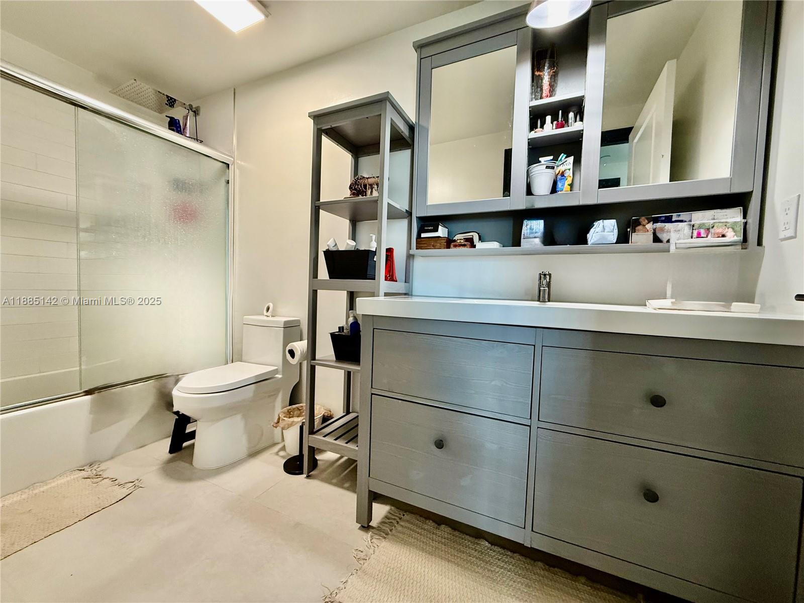 1250 South Miami Avenue, Unit 1603 Miami, FL 33130 - Photo 32 of 44 a room with a cabinets and gym equipment