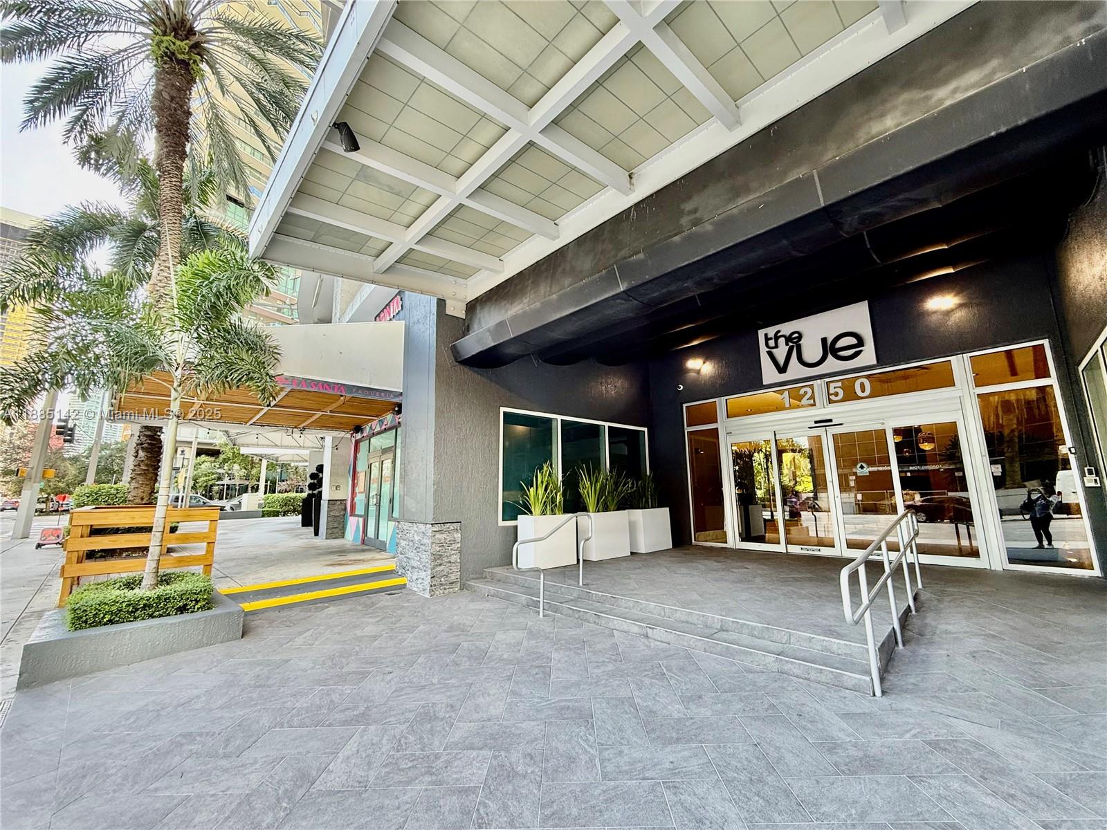 1250 South Miami Avenue, Unit 1603 Miami, FL 33130 - Photo 39 of 44 an entryway of a building with couches and a ceiling fan