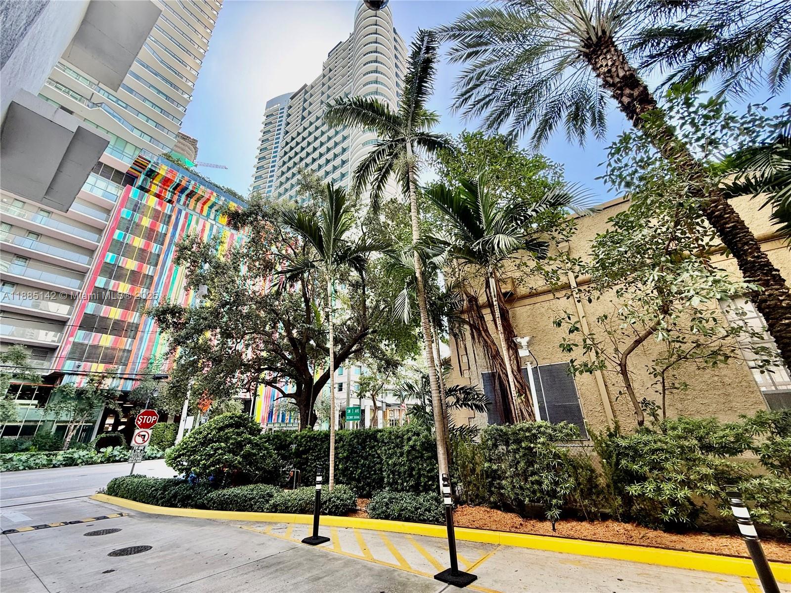 1250 South Miami Avenue, Unit 1603 Miami, FL 33130 - Photo 43 of 44 a view of a swimming pool with an outdoor space and seating area