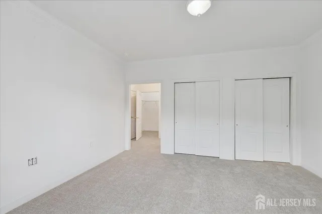 a spacious bathroom with a shower sink mirror and bathtub