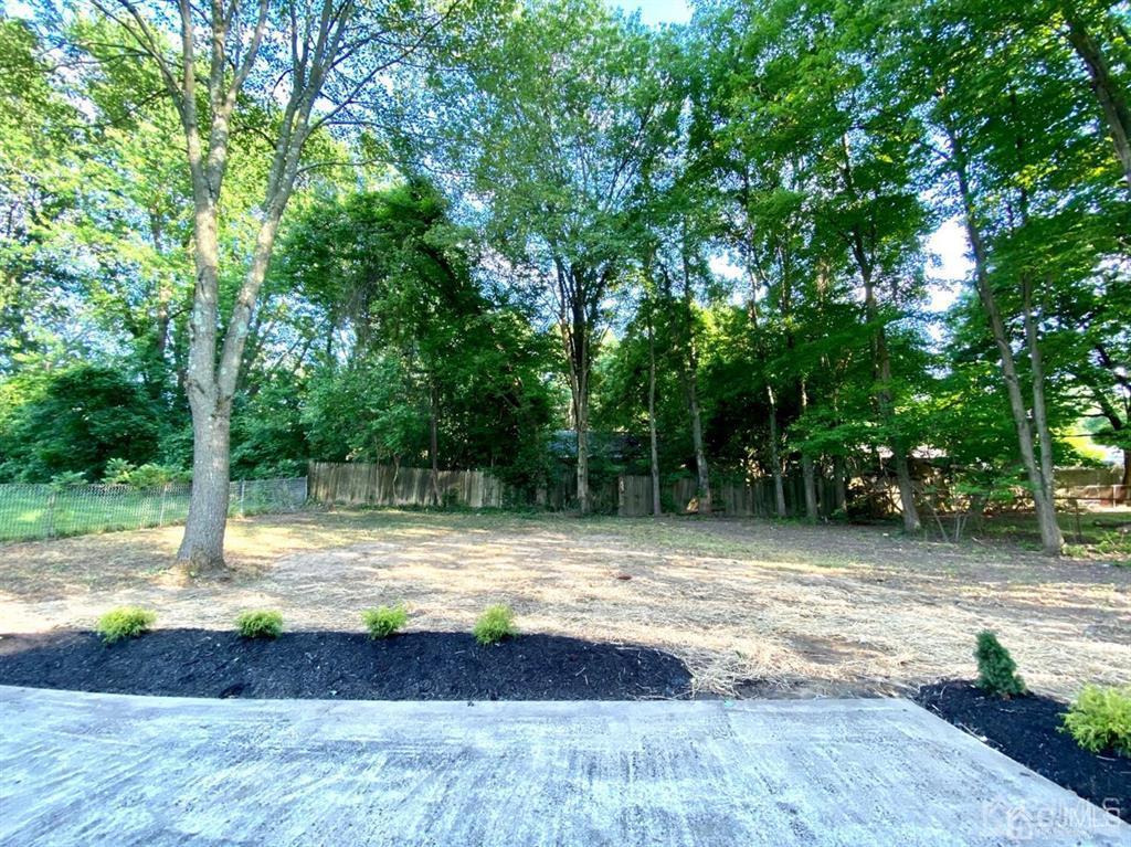 23 Springdale Road Kendall Park, NJ 08824 - Photo 22 of 26 a view of swimming pool with a yard