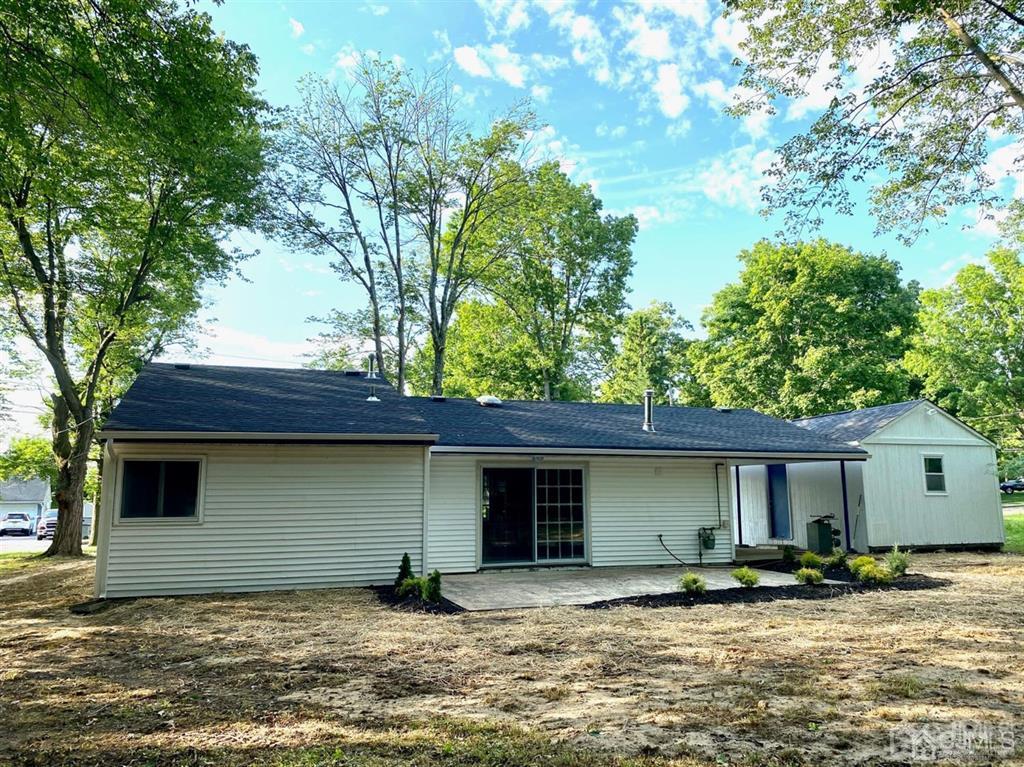 23 Springdale Road Kendall Park, NJ 08824 - Photo 26 of 26 a house that has a tree in front of it