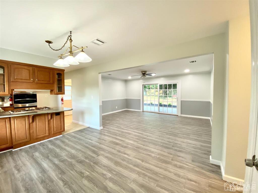 23 Springdale Road Kendall Park, NJ 08824 - Photo 3 of 26 a view of a kitchen with a sink and microwave