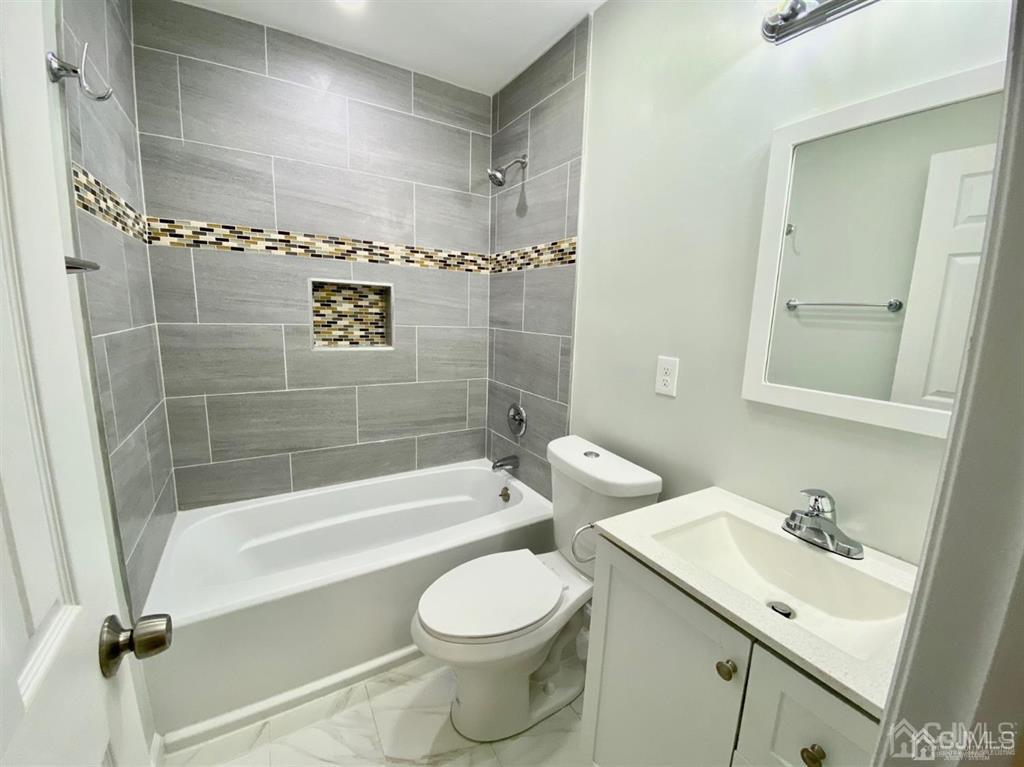 23 Springdale Road Kendall Park, NJ 08824 - Photo 10 of 26 a bathroom with a sink toilet and shower