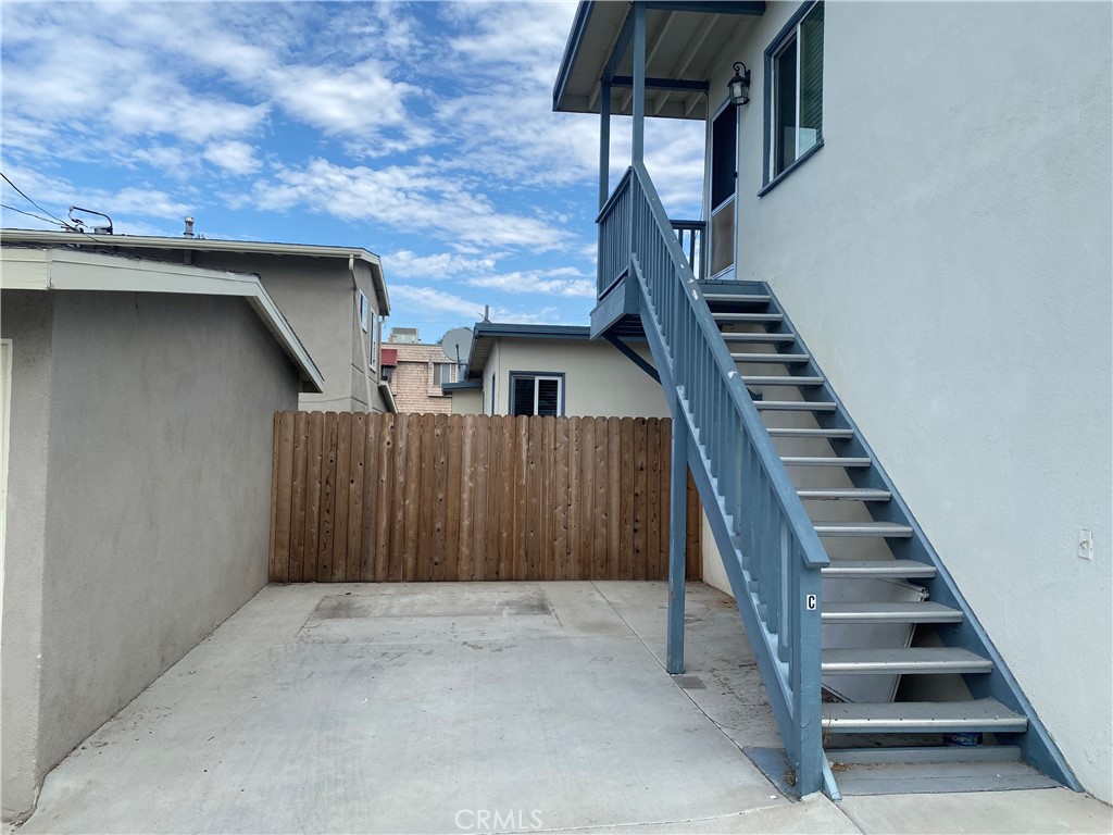 149 Avenida Cabrillo, Unit C San Clemente, CA 92672 - Photo 1 of 8 a view of a staircase with wooden walls and stairs