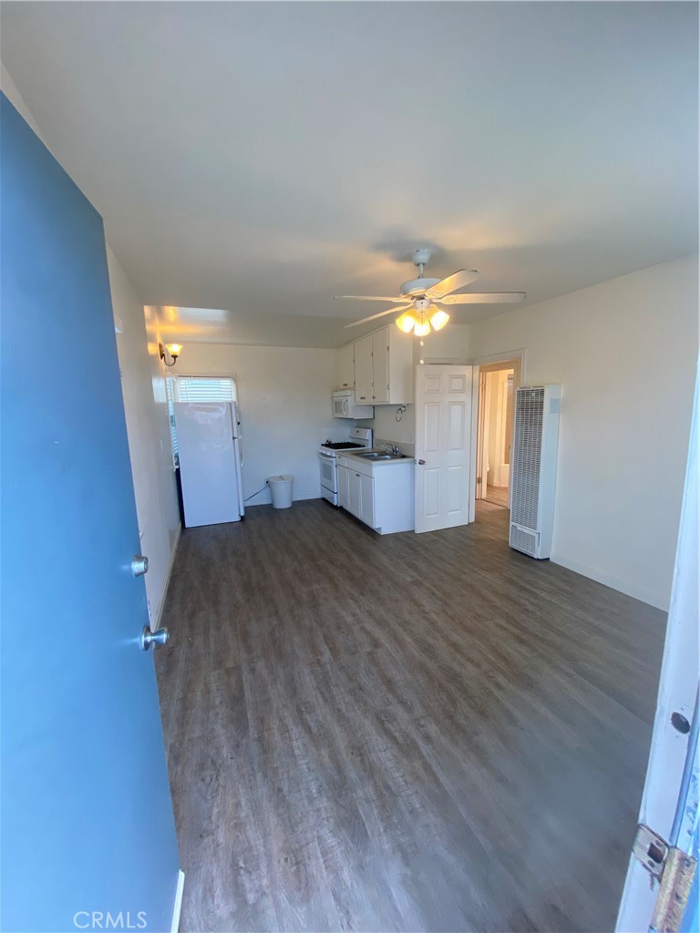 149 Avenida Cabrillo, Unit C San Clemente, CA 92672 - Photo 4 of 8 a room with a bed and cabinets