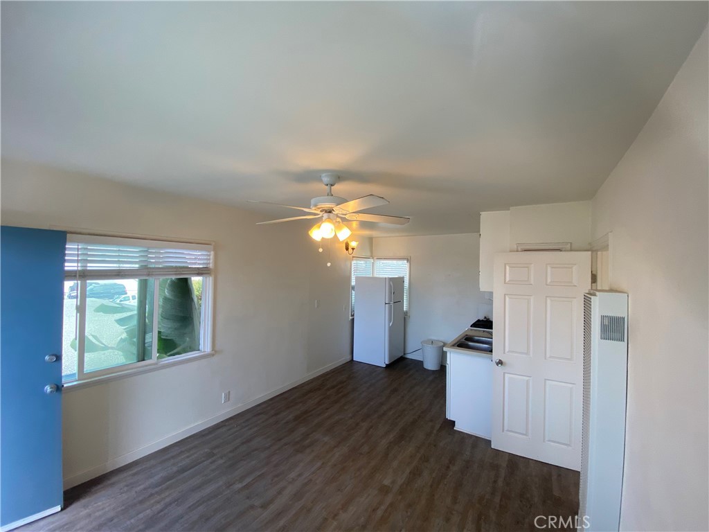 149 Avenida Cabrillo, Unit C San Clemente, CA 92672 - Photo 5 of 8 a view of a kitchen with wooden floor electronic appliances and windows